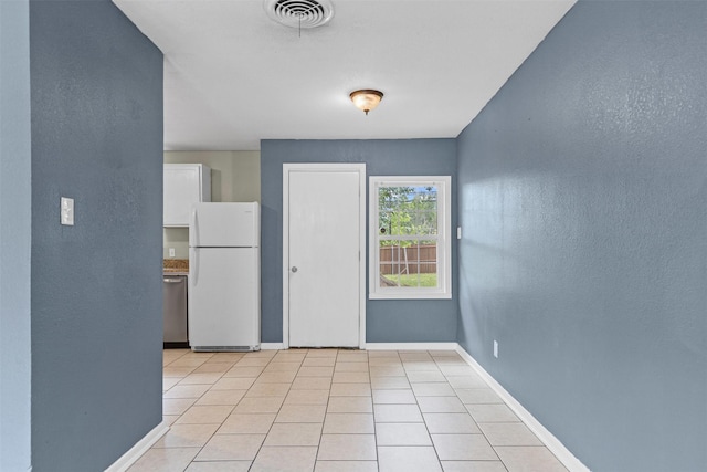 3508 Valencia Ct, Fort Worth, TX 76116 - empty room with baseboards, a textured wall, and light tile patterned floors