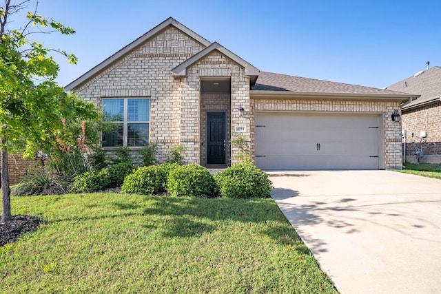 4714 Crestwood Dr, Haltom City, TX 76137 - view of front facade with a front yard, a garage, brick siding, and concrete driveway