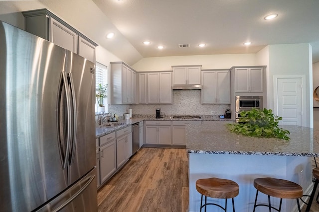4714 Crestwood Dr, Haltom City, TX 76137 - kitchen featuring stainless steel appliances, gray cabinets, a sink, under cabinet range hood, and recessed lighting