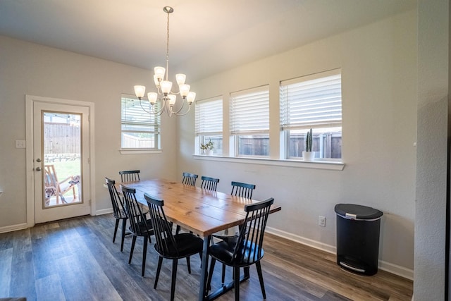 4714 Crestwood Dr, Haltom City, TX 76137 - dining room featuring a chandelier, dark wood-type flooring, and baseboards