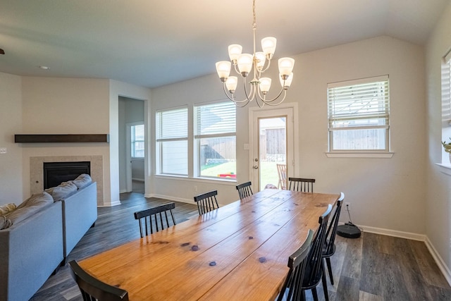 4714 Crestwood Dr, Haltom City, TX 76137 - dining room with baseboards, a chandelier, dark wood-style flooring, and a tiled fireplace