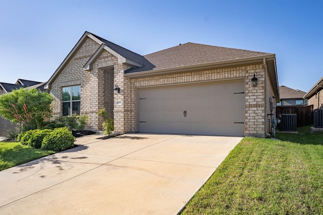 4714 Crestwood Dr, Haltom City, TX 76137 - view of front facade featuring cooling unit, a garage, concrete driveway, stone siding, and roof with shingles