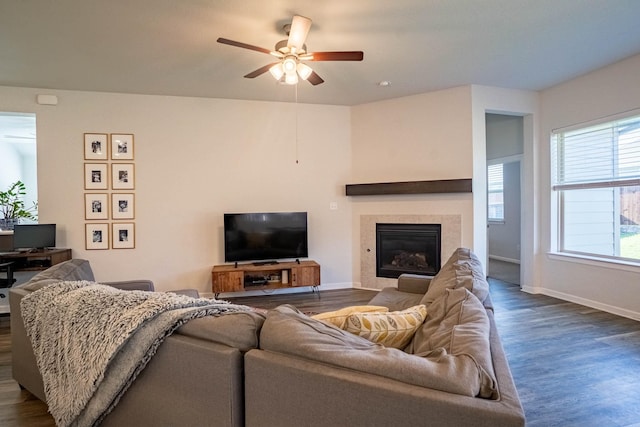 4714 Crestwood Dr, Haltom City, TX 76137 - living area featuring ceiling fan, dark wood-type flooring, baseboards, and a tiled fireplace