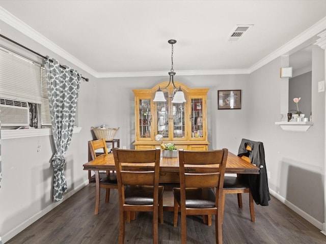 707 Washington St, Ennis, TX 75119 - dining space with dark wood-style floors, baseboards, crown molding, cooling unit, and a chandelier