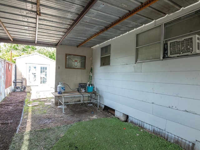 707 Washington St, Ennis, TX 75119 - view of patio featuring cooling unit