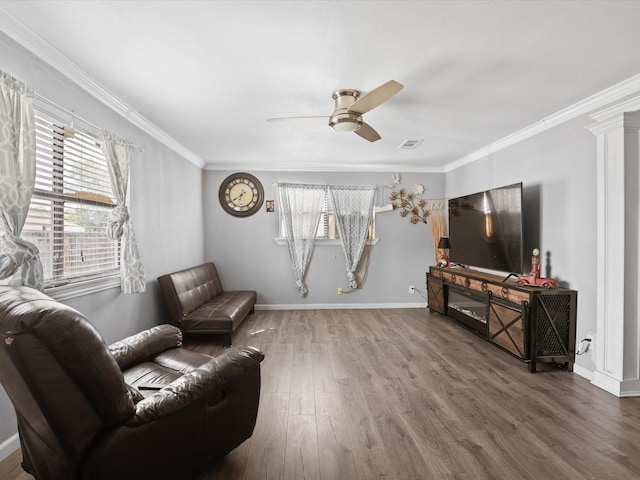 707 Washington St, Ennis, TX 75119 - sitting room featuring wood finished floors, ceiling fan, ornamental molding, and baseboards