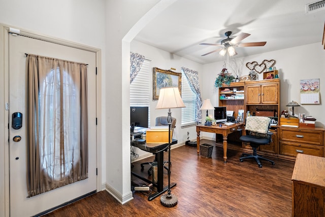 169 Savannah Dr, Brock, TX 76087 - office area featuring ceiling fan, arched walkways, dark wood-type flooring, and baseboards