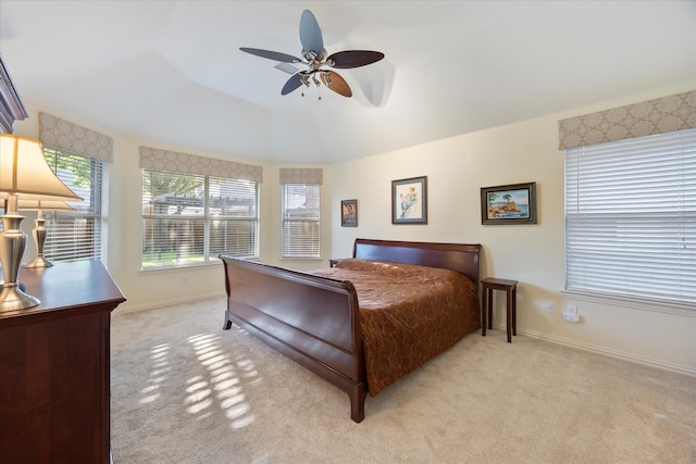676 Woodland Way, Rockwall, TX 75087 - bedroom with light carpet, baseboards, and a ceiling fan
