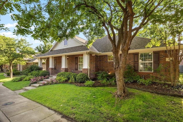676 Woodland Way, Rockwall, TX 75087 - view of front of property featuring brick siding, a front lawn, and roof with shingles
