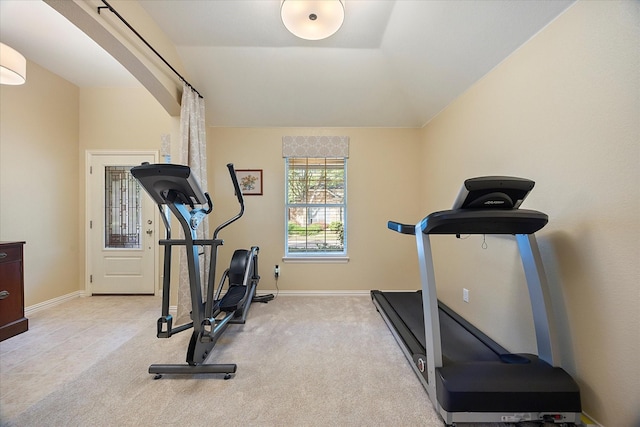 676 Woodland Way, Rockwall, TX 75087 - workout room featuring baseboards, arched walkways, vaulted ceiling, and carpet