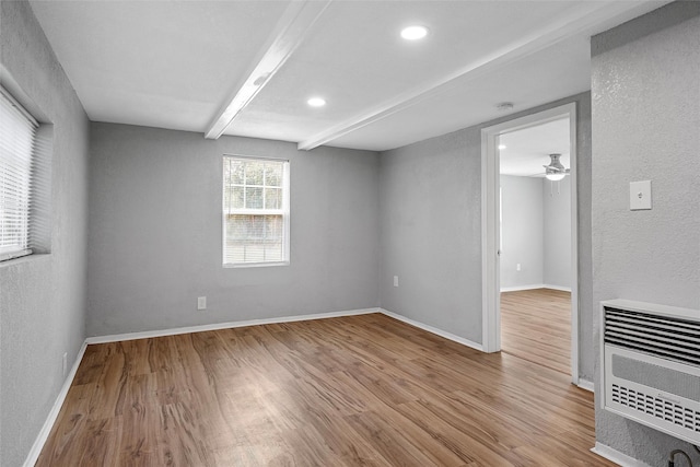 2511 S 7th, Waco, TX 76706 - empty room with wood finished floors, heating unit, baseboards, beam ceiling, and recessed lighting