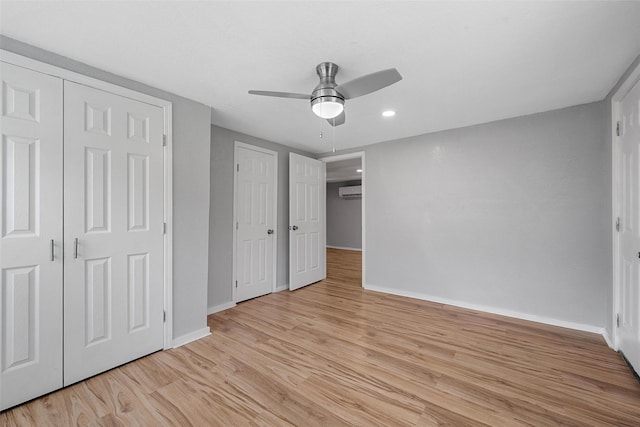 2511 S 7th, Waco, TX 76706 - unfurnished bedroom featuring baseboards, light wood-style floors, a wall unit AC, recessed lighting, and ceiling fan
