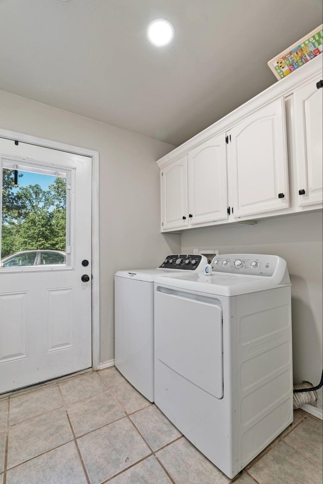 3966 Farm Road 196 N, Paris, TX 75462 - laundry room featuring cabinet space, washer and dryer, light tile patterned floors, and baseboards