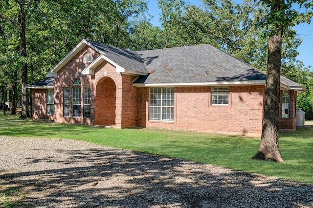3966 Farm Road 196 N, Paris, TX 75462 - ranch-style house featuring brick siding, a front lawn, and a shingled roof