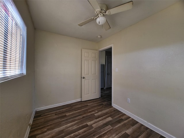 1906 N 4th St, Killeen, TX 76541 - spare room with baseboards, dark wood finished floors, and a ceiling fan
