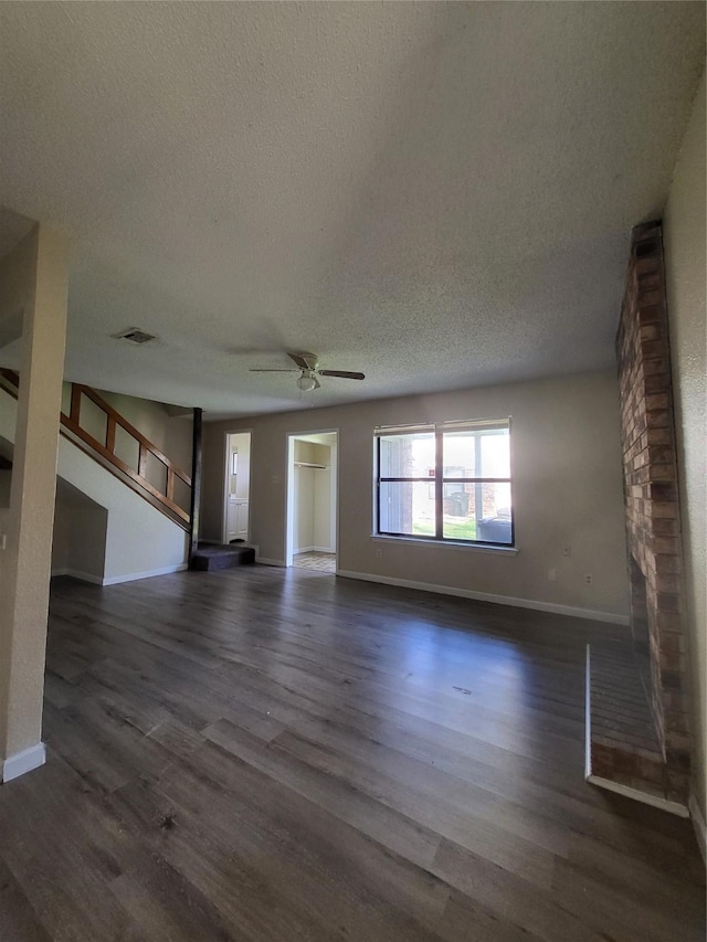 1906 N 4th St, Killeen, TX 76541 - unfurnished living room with a textured ceiling, a ceiling fan, dark wood-type flooring, and baseboards