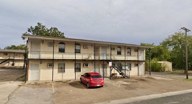 1906 N 4th St, Killeen, TX 76541 - view of property featuring stairway and uncovered parking