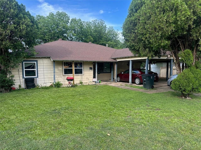 1906 N 4th St, Killeen, TX 76541 - ranch-style house with a carport, a front yard, and roof with shingles