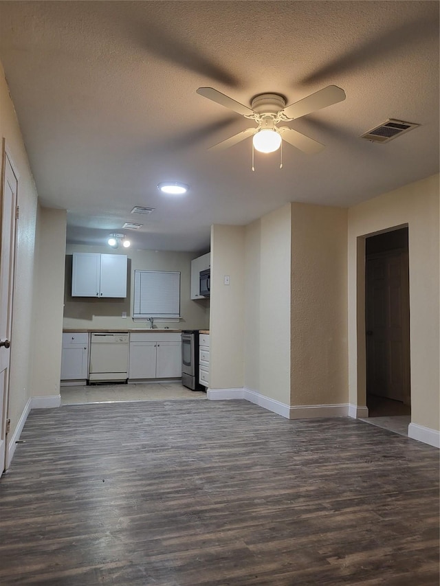 1906 N 4th St, Killeen, TX 76541 - kitchen with white dishwasher, stainless steel electric range oven, wood finished floors, baseboards, and a textured ceiling