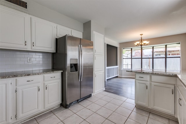 2513 Figtree Ln, Plano, TX 75074 - kitchen featuring stainless steel refrigerator with ice dispenser, a chandelier, white cabinets, and light tile patterned floors