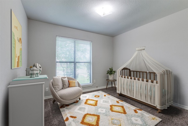 2513 Figtree Ln, Plano, TX 75074 - carpeted bedroom with a nursery area, baseboards, and a textured ceiling