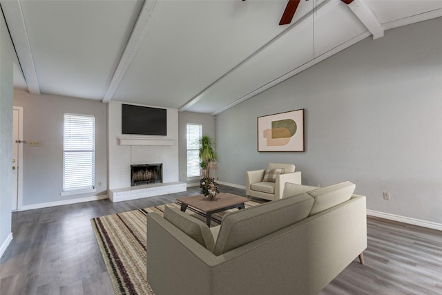 2513 Figtree Ln, Plano, TX 75074 - living room featuring a ceiling fan, baseboards, wood finished floors, and a fireplace