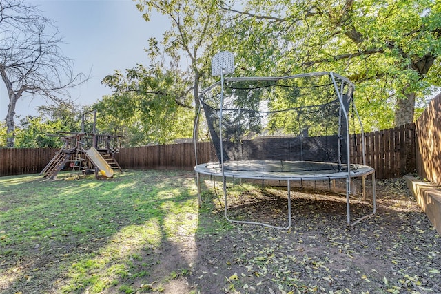1017 Meadowbrook Dr, Grapevine, TX 76051 - view of yard featuring a trampoline and a playground