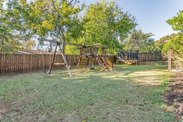 1017 Meadowbrook Dr, Grapevine, TX 76051 - view of yard featuring a trampoline and a playground