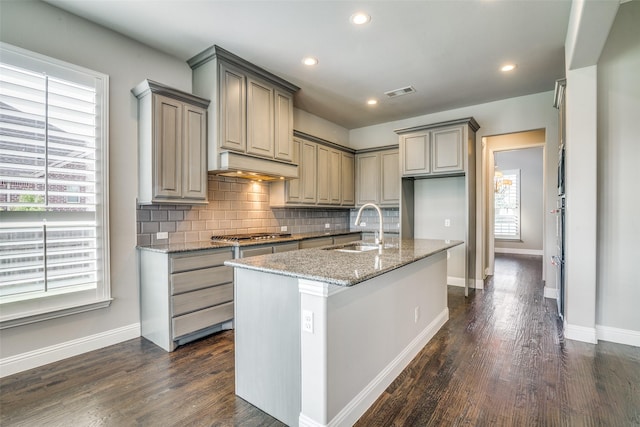 344 Redstone Dr, Sunnyvale, TX 75182 - kitchen with a sink, healthy amount of natural light, custom range hood, decorative backsplash, and recessed lighting