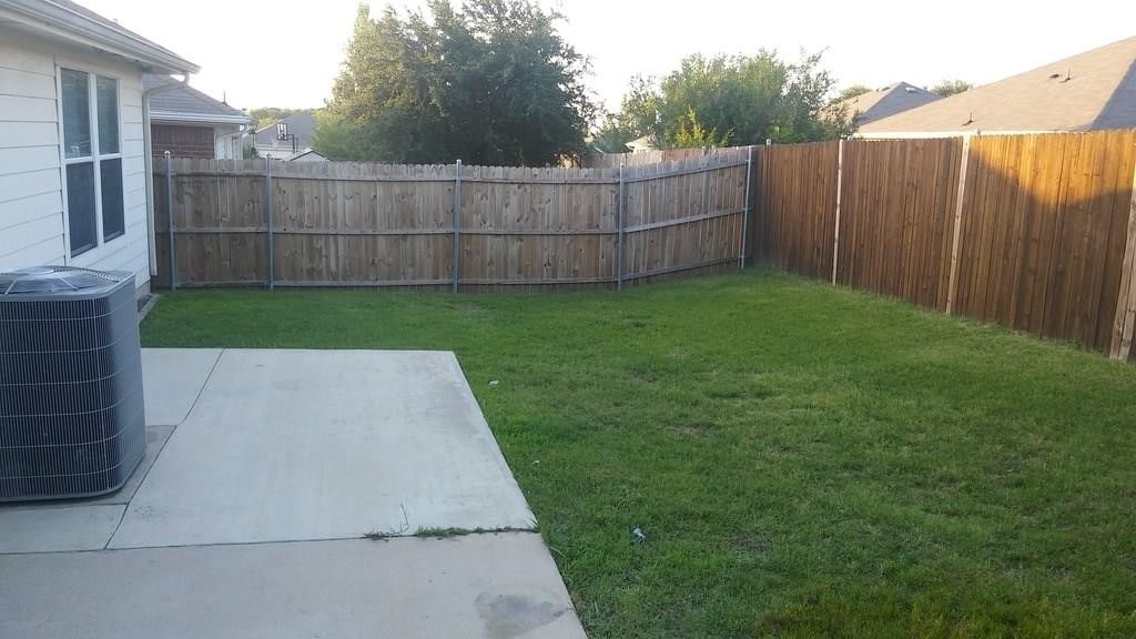 5658 Hunters Bend Ln, Dallas, TX 75249 - view of yard featuring central AC unit and a patio