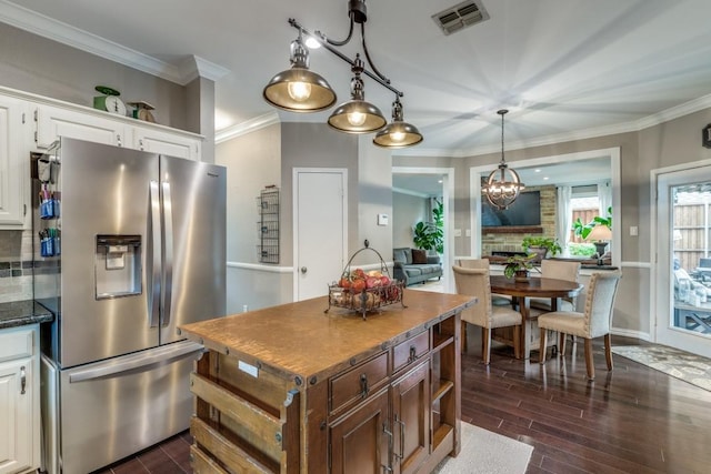 10613 Raleigh Dr, Frisco, TX 75035 - kitchen featuring stainless steel fridge with ice dispenser, backsplash, crown molding, white cabinetry, and dark wood-style flooring