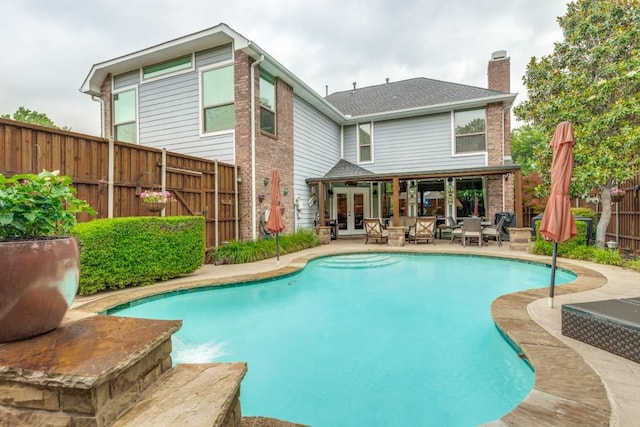 10613 Raleigh Dr, Frisco, TX 75035 - view of pool featuring french doors, a fenced backyard, and a patio