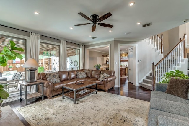 10613 Raleigh Dr, Frisco, TX 75035 - living area featuring ornamental molding, stairs, a ceiling fan, wood finished floors, and recessed lighting