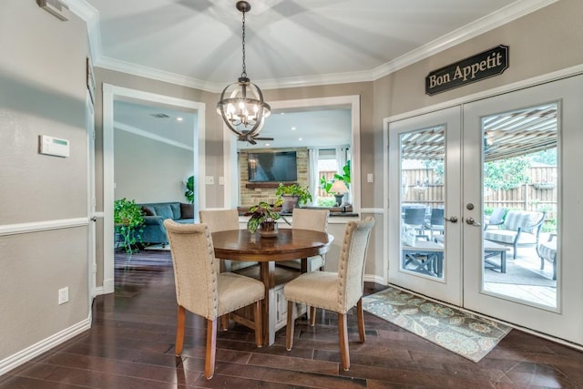10613 Raleigh Dr, Frisco, TX 75035 - dining area with a chandelier, plenty of natural light, dark wood-type flooring, crown molding, and french doors
