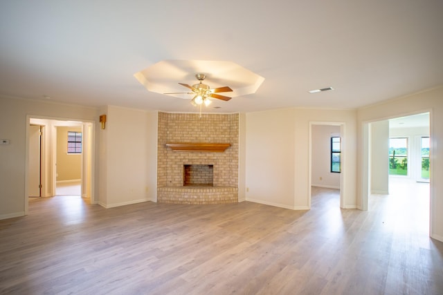 812 Crestline Dr, Mexia, TX 76667 - unfurnished living room featuring ceiling fan, wood finished floors, ornamental molding, a fireplace, and baseboards