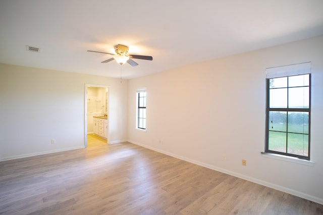 812 Crestline Dr, Mexia, TX 76667 - empty room featuring ceiling fan, light wood finished floors, and baseboards