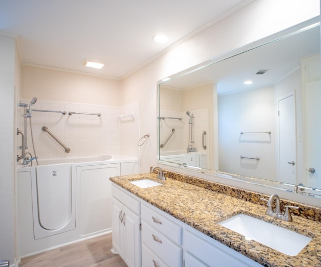 812 Crestline Dr, Mexia, TX 76667 - full bath with wood finished floors, a garden tub, ornamental molding, double vanity, and a shower