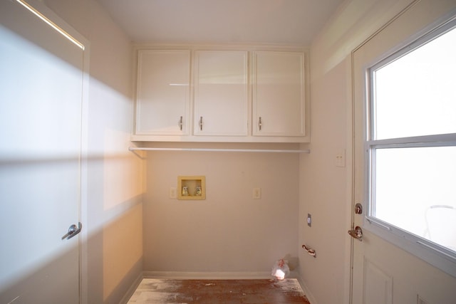812 Crestline Dr, Mexia, TX 76667 - laundry room featuring hookup for a washing machine, cabinet space, wood finished floors, and baseboards
