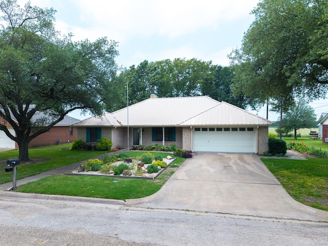 812 Crestline Dr, Mexia, TX 76667 - ranch-style house featuring brick siding, an attached garage, a front lawn, driveway, and metal roof