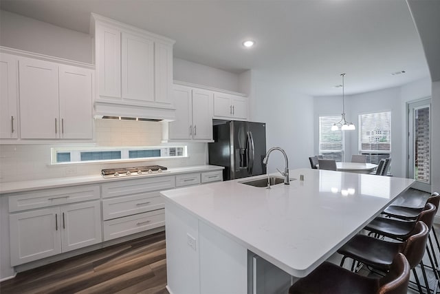 12959 Averi Ln, Farmers Branch, TX 75234 - kitchen featuring black fridge, a sink, dark wood-style floors, decorative backsplash, and recessed lighting