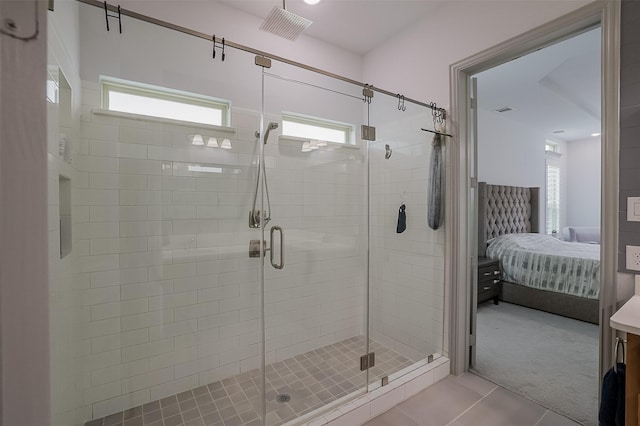 12959 Averi Ln, Farmers Branch, TX 75234 - bathroom featuring ensuite bath, tile patterned flooring, a stall shower, and healthy amount of natural light