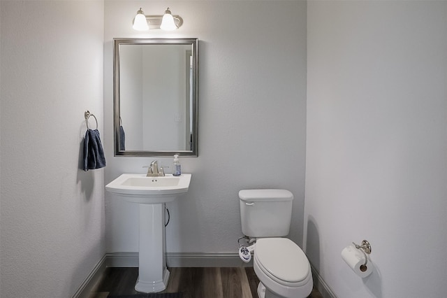 12959 Averi Ln, Farmers Branch, TX 75234 - half bathroom with wood finished floors, toilet, and baseboards
