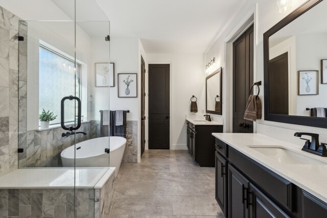 5221 Sylvan Shores Dr, Frisco, TX 75036 - full bath featuring two vanities, a freestanding bath, and a stall shower