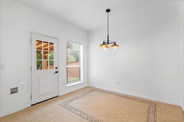5919 Wisdom Creek Dr, Dallas, TX 75249 - unfurnished dining area featuring light tile patterned flooring and baseboards