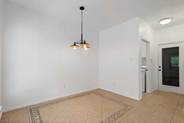 5919 Wisdom Creek Dr, Dallas, TX 75249 - unfurnished dining area featuring light tile patterned flooring and baseboards