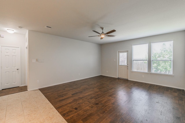 2409 Buelingo Ln, Fort Worth, TX 76131 - empty room with ceiling fan, dark wood-style floors, and baseboards