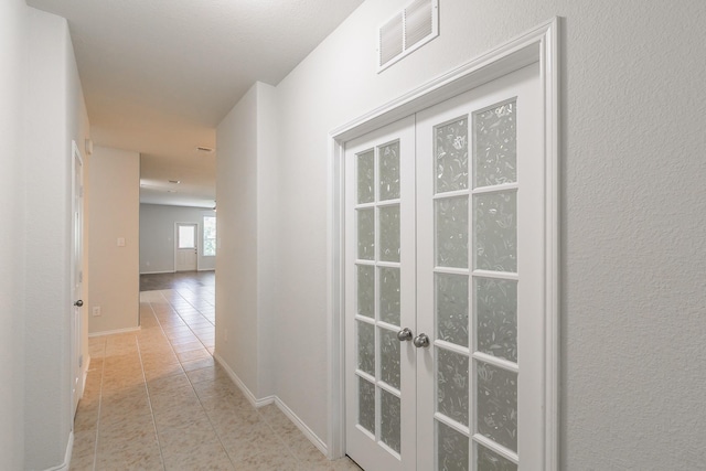 2409 Buelingo Ln, Fort Worth, TX 76131 - hall with tile patterned flooring, french doors, and baseboards