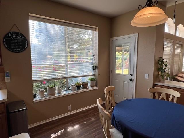 1275 Calistoga Dr, Rockwall, TX 75087 - dining room featuring dark wood-style floors and baseboards