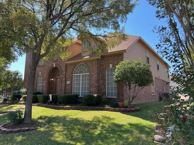 1275 Calistoga Dr, Rockwall, TX 75087 - view of front of property featuring brick siding and a front lawn