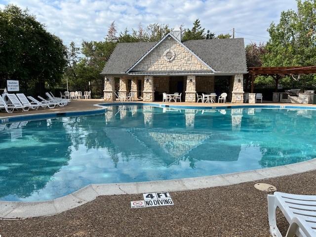 1275 Calistoga Dr, Rockwall, TX 75087 - community pool with a pergola and a patio area